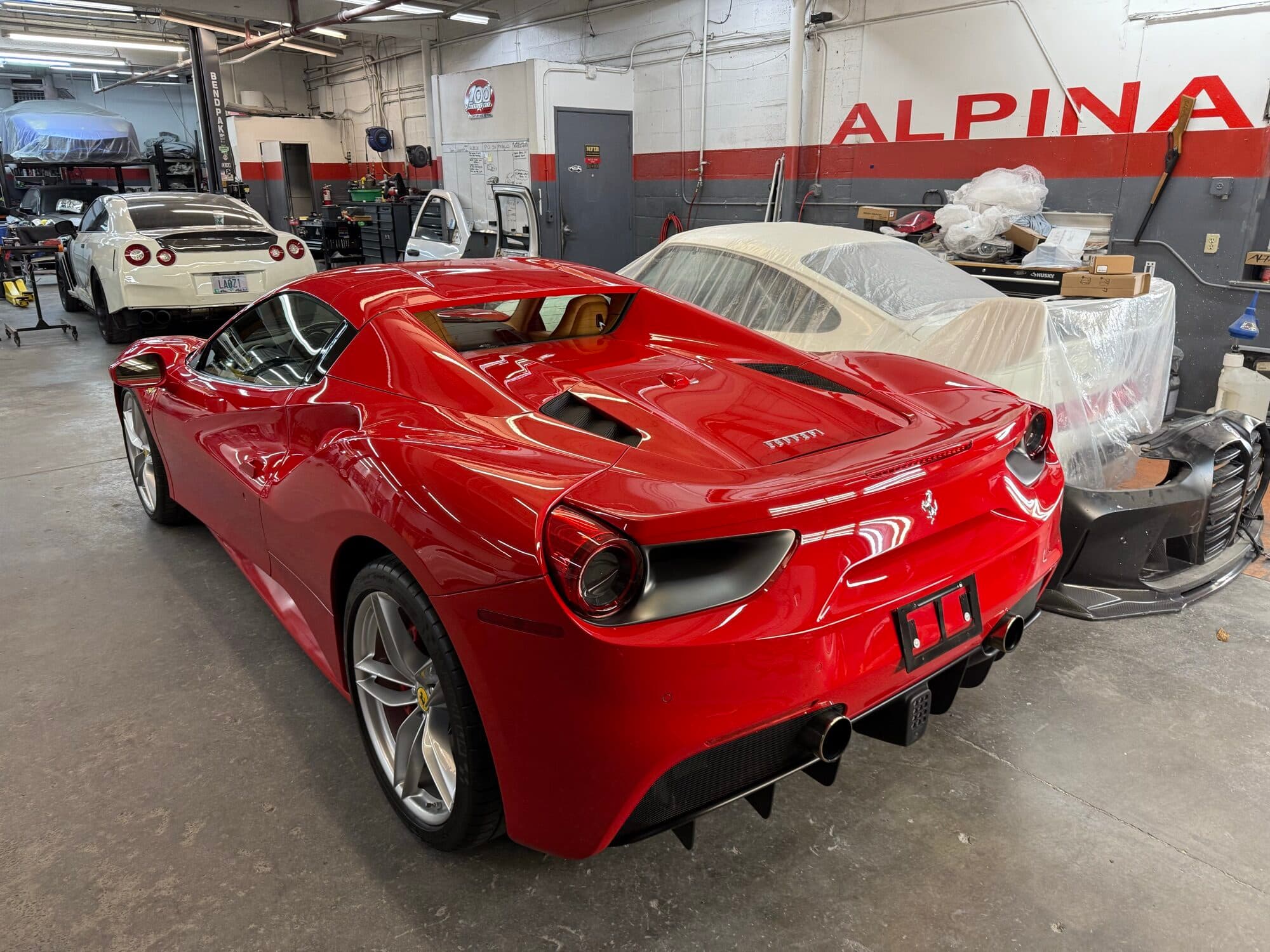 Ferrari 488 red rear three-quarter at Alpina Auto Body, Southeast Portland