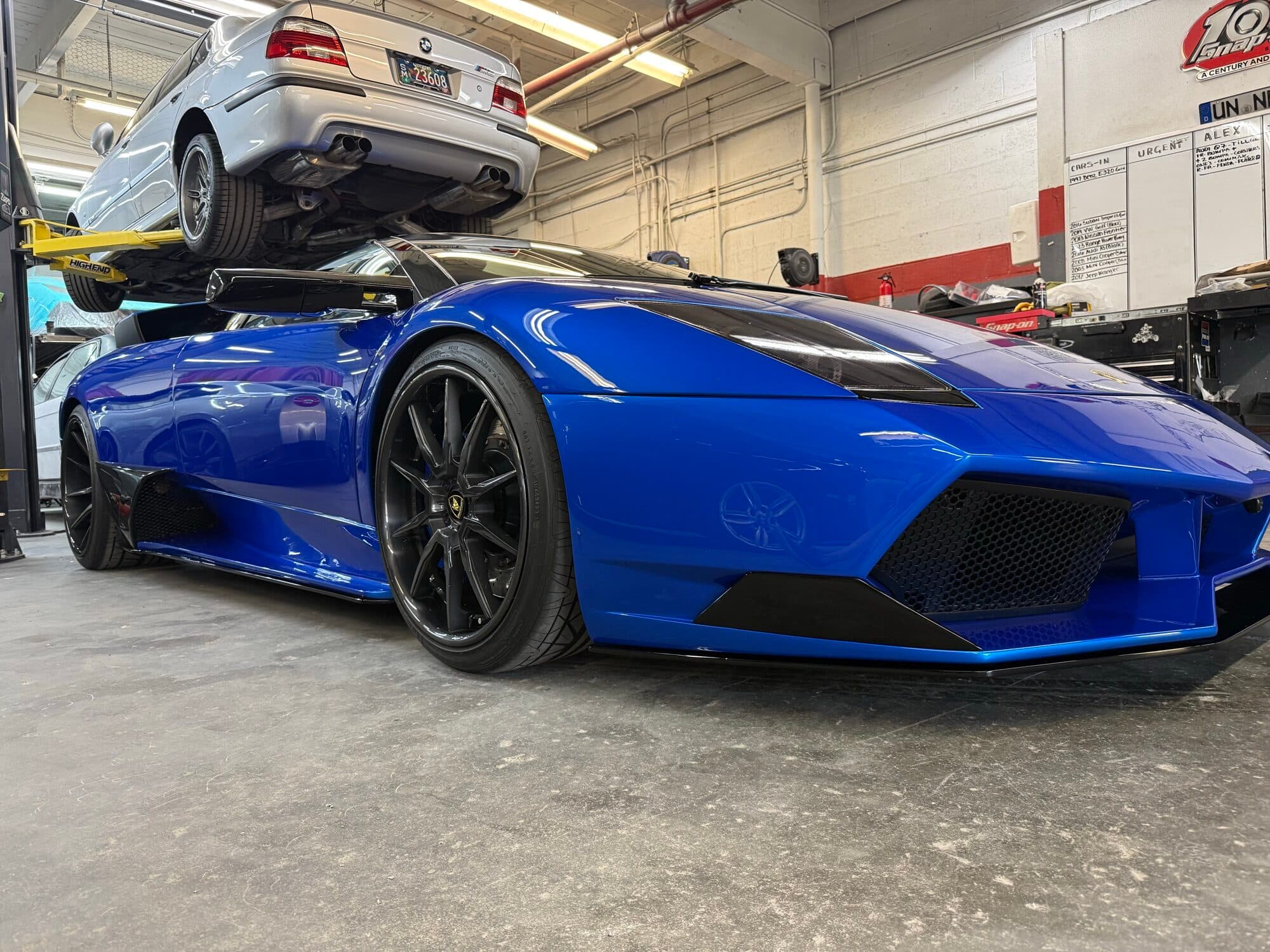 A blue Lamborghini Aventador in for carbon fiber work at Alpina Auto Body, Southeast Portland