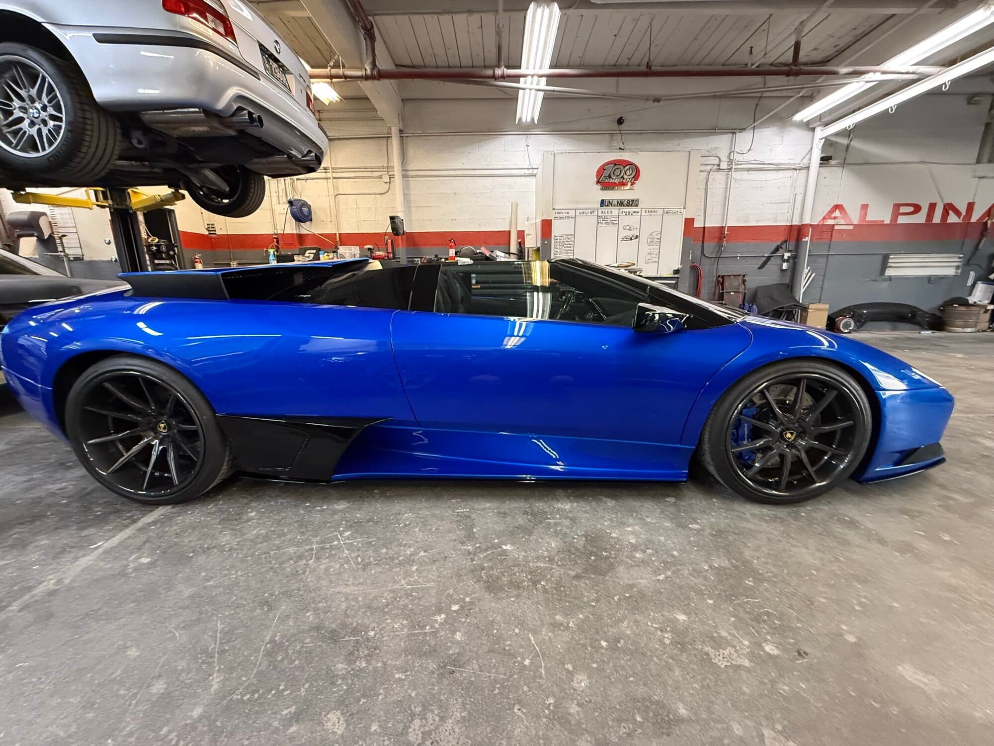 Blue Lamborghini Murciélago, the owner's car, inside the Alpina Auto Body shop, an exotic auto body repair shop in Southeast Portland, Oregon