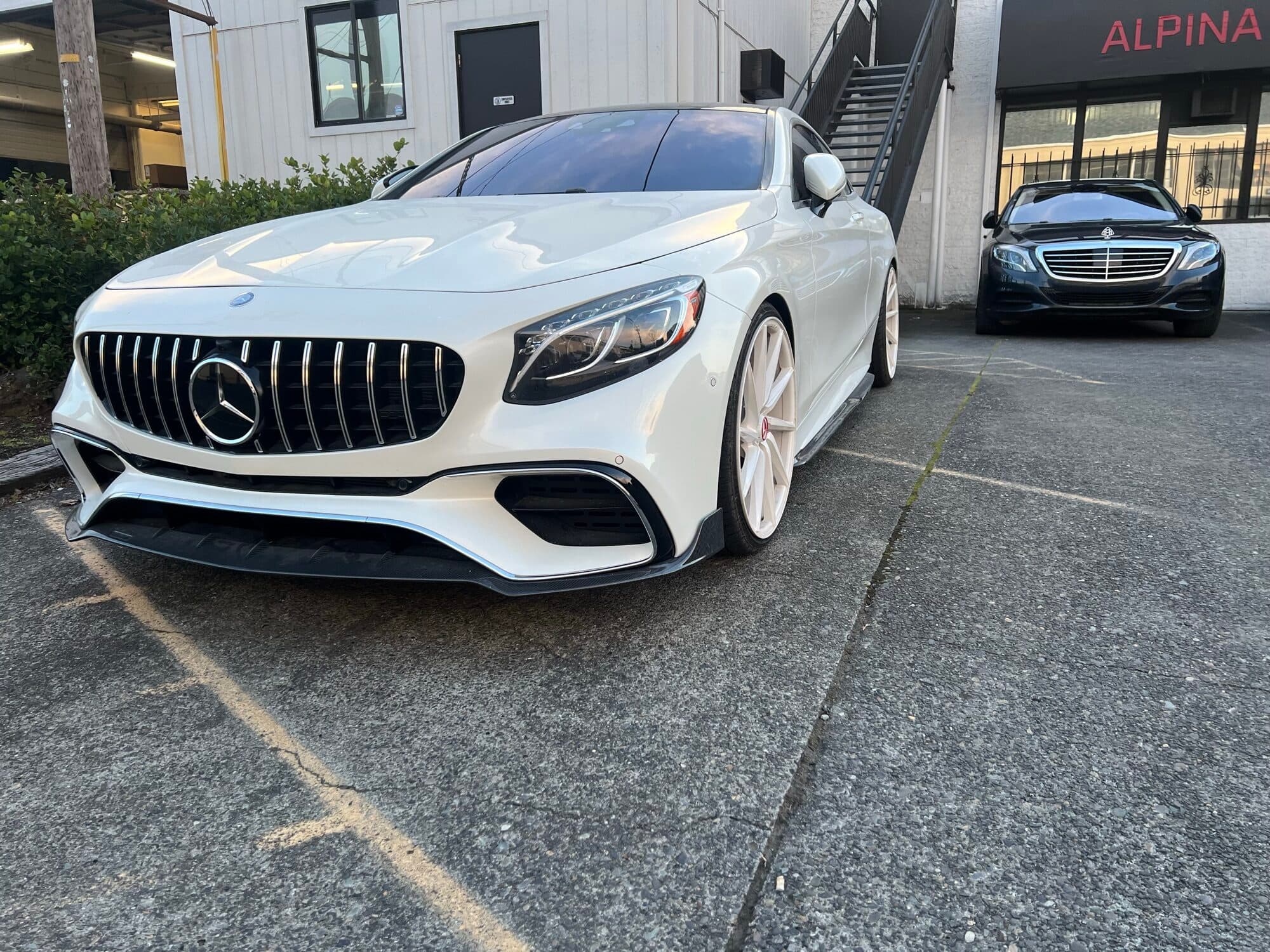 White Mercedes-AMG coupe in front of the Alpina Auto Body shop, Southeast Portland