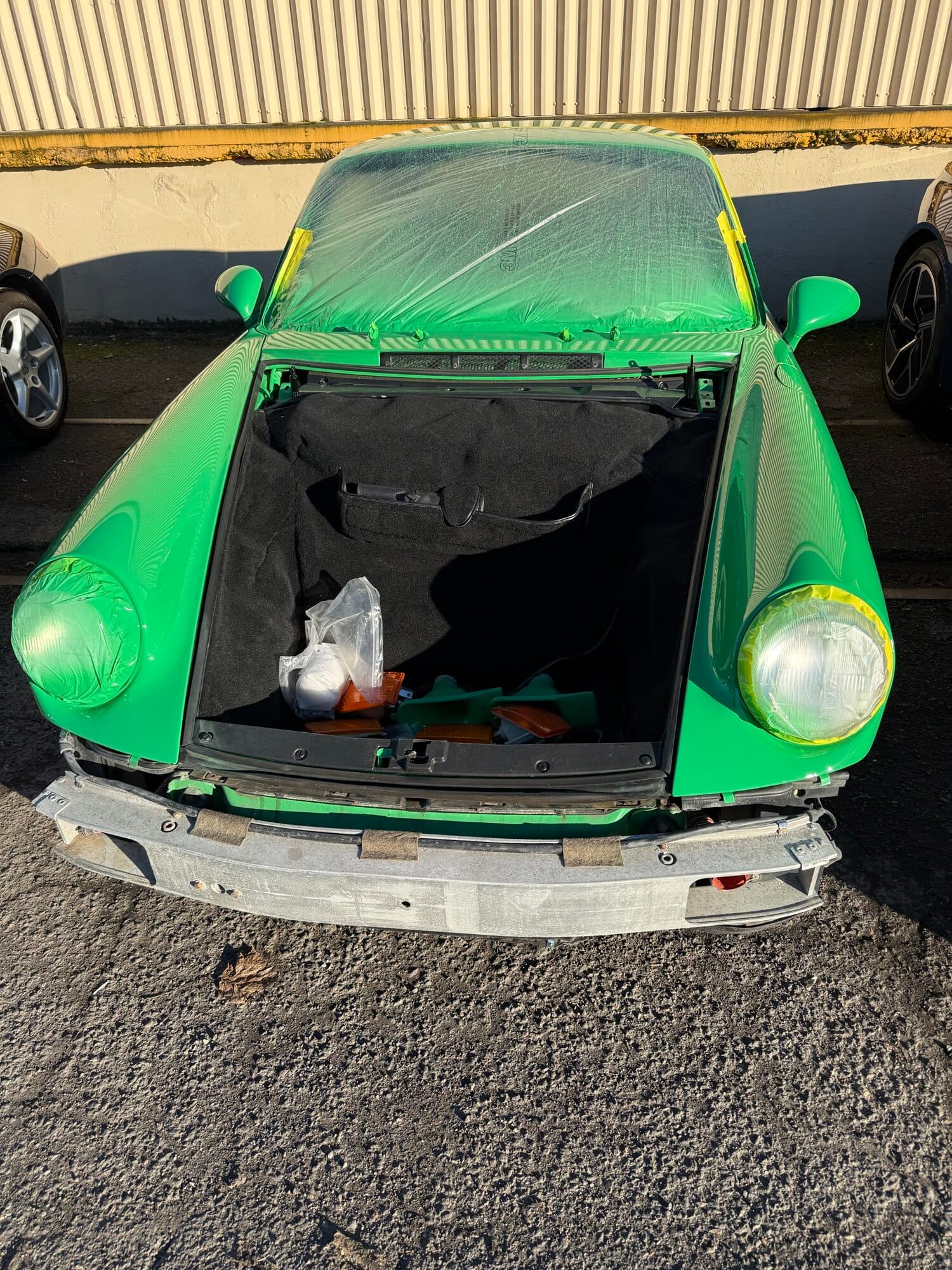 Green air-cooled classic Porsche 911 mid restoration at Alpina Auto Body, classic car paint and body shop in Southeast Portland, Oregon