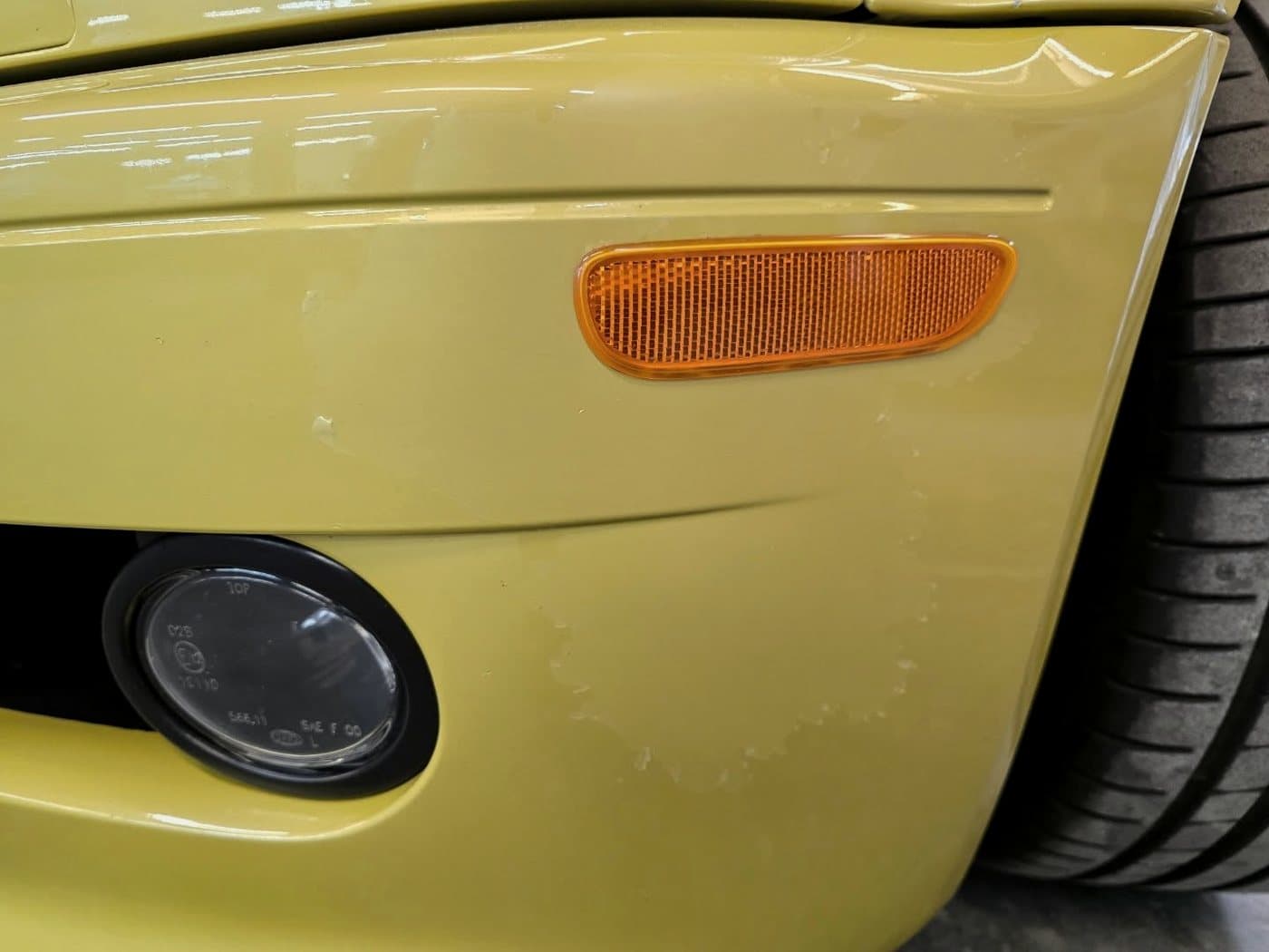 A yellow BMW M3 with a flawless, color-matched panel at Alpina Auto Body